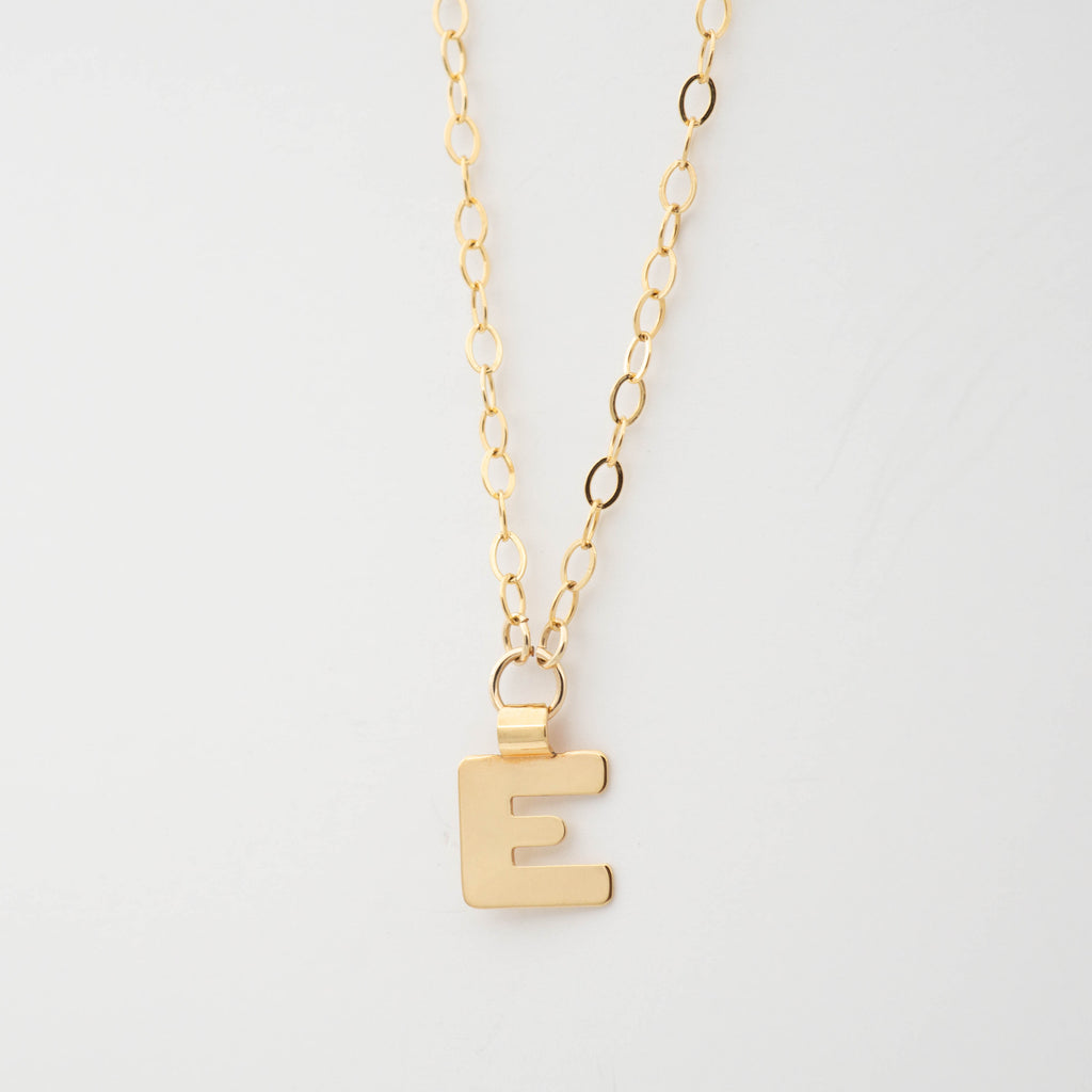 Gold initial necklace letter E