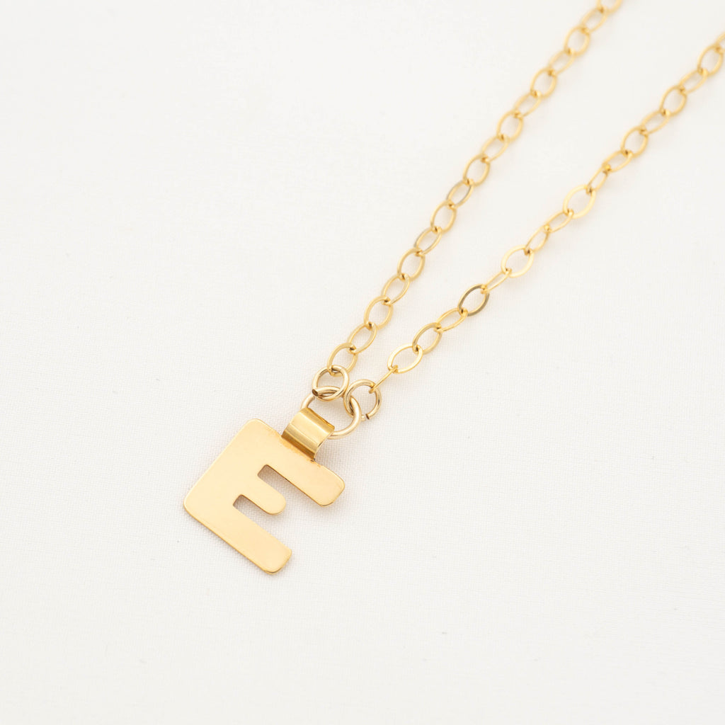 Gold initial necklace letter E